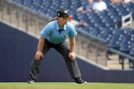 FILE - Umpire Jen Pawol takes her position during the first inning of a spring training...