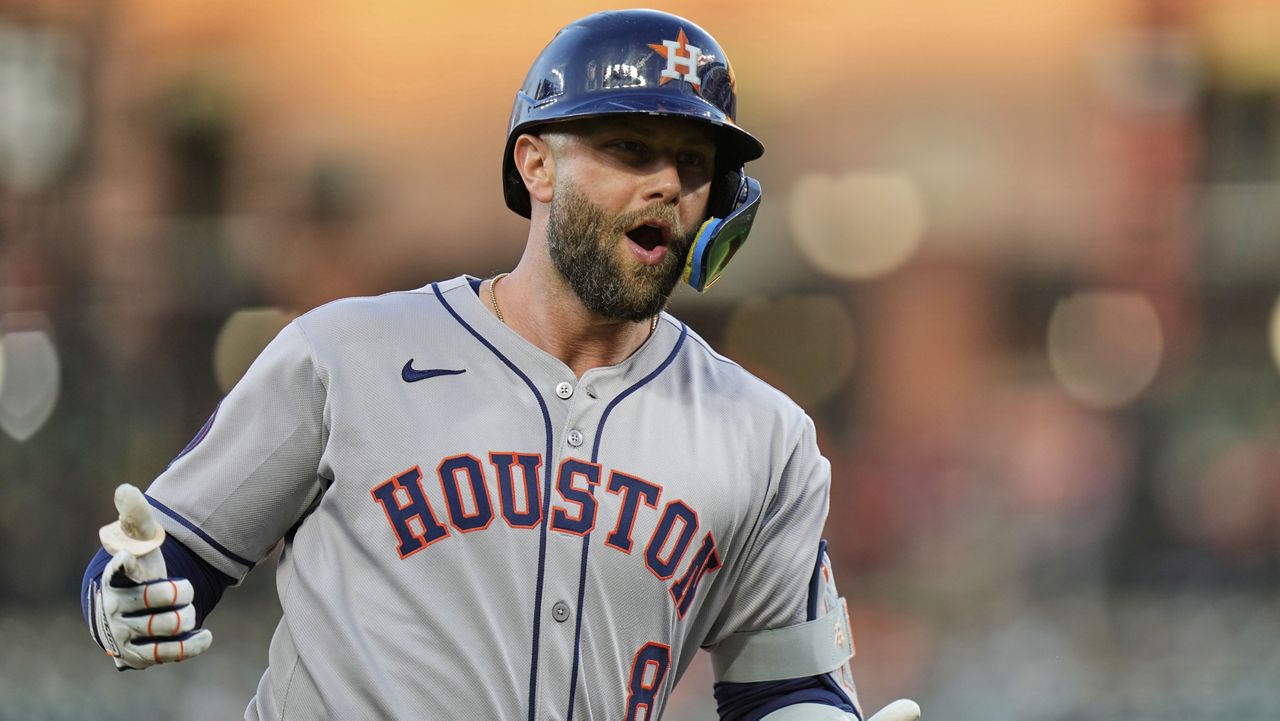 Houston Astros' Christian Walker reacts toward the dugout after hitting a two-run home run during the first inning of a baseball game against the Baltimore Orioles, Thursday, Aug. 21, 2025, in Baltimore. (AP Photo/Stephanie Scarbrough)