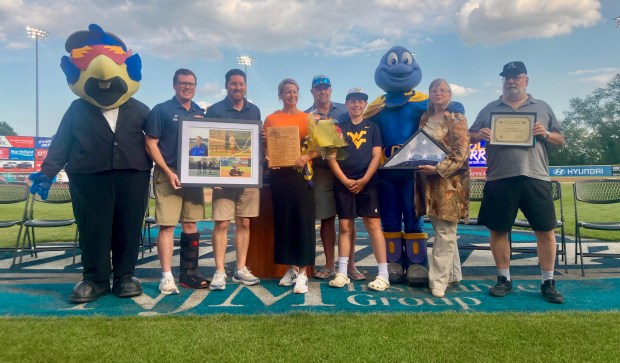 Baltimore Orioles head groundskeeper Nicole Sherry poses with family, Thunder...