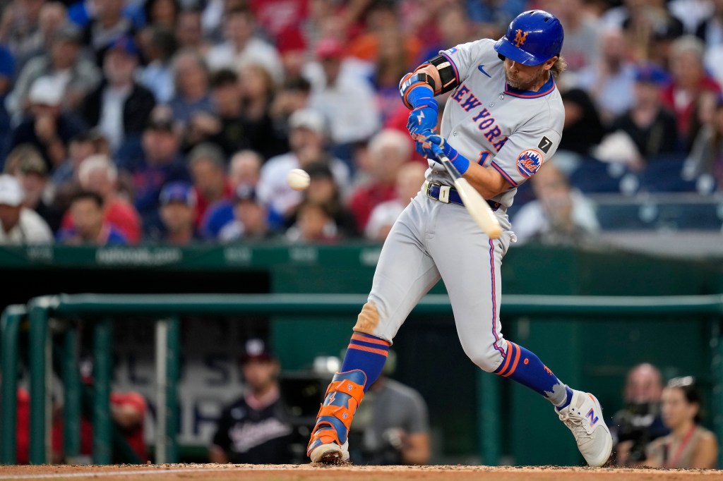 Jeff McNeil, who hit a solo homer later in the game, belts a two-run double during the Mets' blowout win over the Nationals.