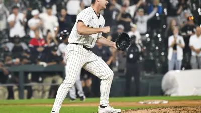 Aug 12, 2025; Chicago, Illinois, USA; Chicago White Sox pitcher Jordan Leasure (49) pumps his fist after the game against the Detroit Tigers at Rate Field.