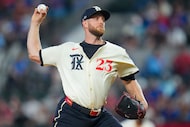 Texas Rangers pitcher Merrill Kelly throws a pitch to the Philadelphia Phillies during the...