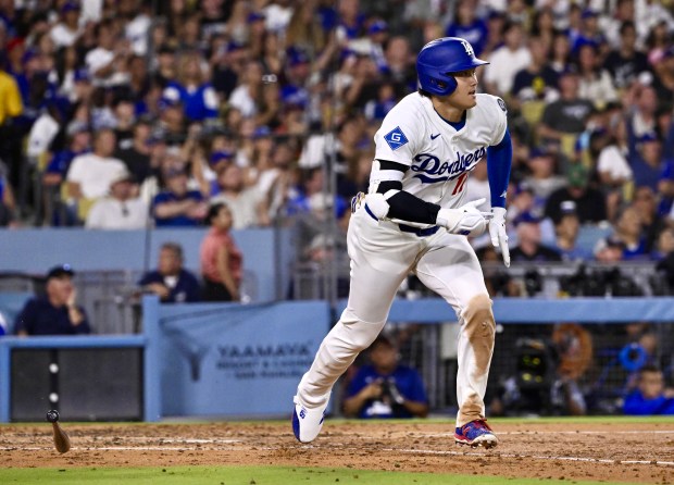 Shohei Ohtani #17 of the Dodgers singles against the Toronto...