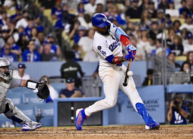 Teoscar Hernández #37 of the Dodgers hits a sac fly...