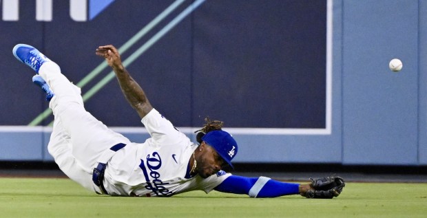 Centerfielder Justin Dean #75 of the Dodgers can’t reach a...