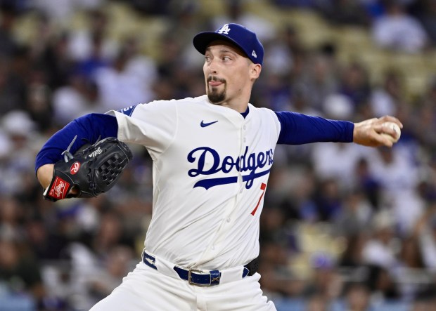 Dodgers starting pitcher Blake Snell throws to the plate during...