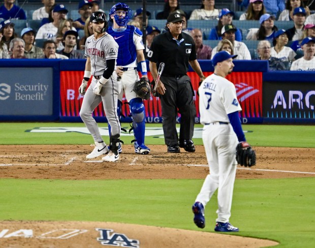 The Arizona Diamondbacks’ Blaze Alexander, left, watches the flight of...