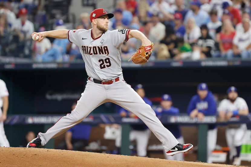 Arizona Diamondbacks starting pitcher Merrill Kelly (29) delivers during the fourth inning...
