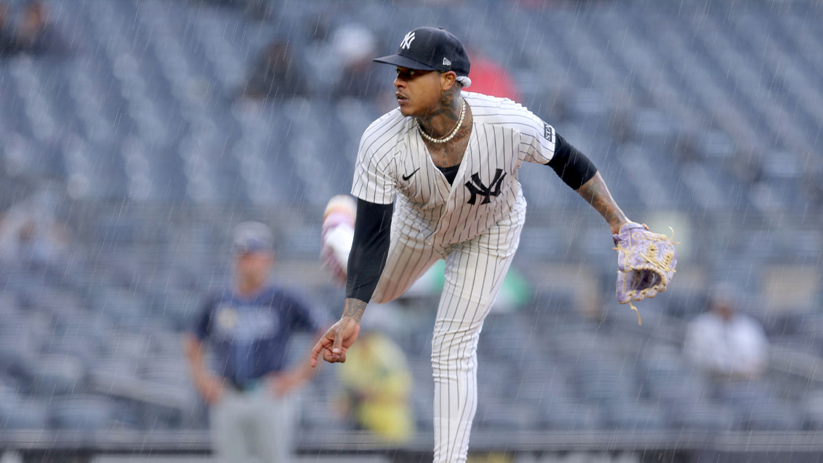 New York Yankees starting pitcher Marcus Stroman (0) follows through on a pitch against the Tampa Bay Rays during the fifth inning at Yankee Stadium.