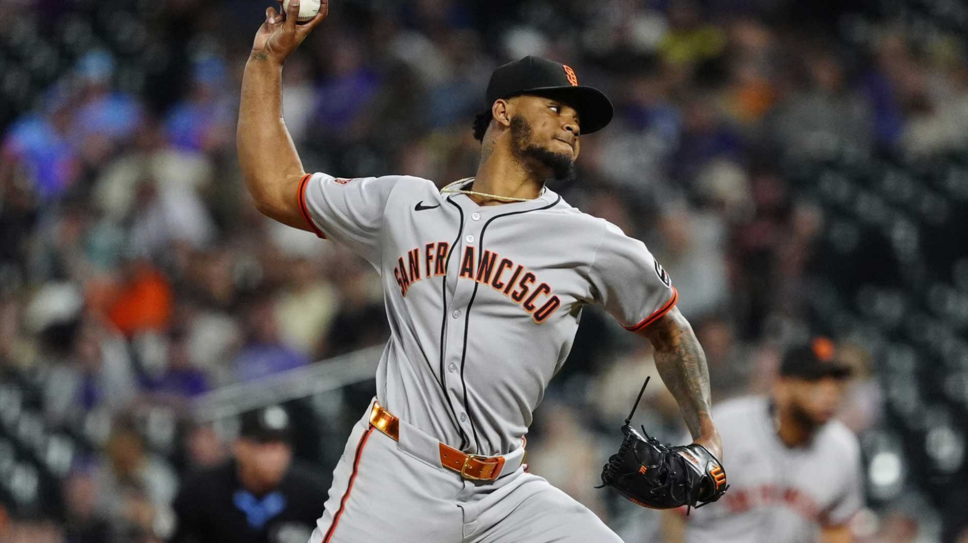 San Francisco Giants relief pitcher Camilo Doval (75) delivers a pitch in the ninth inning against the Colorado Rockies at Coors Field.