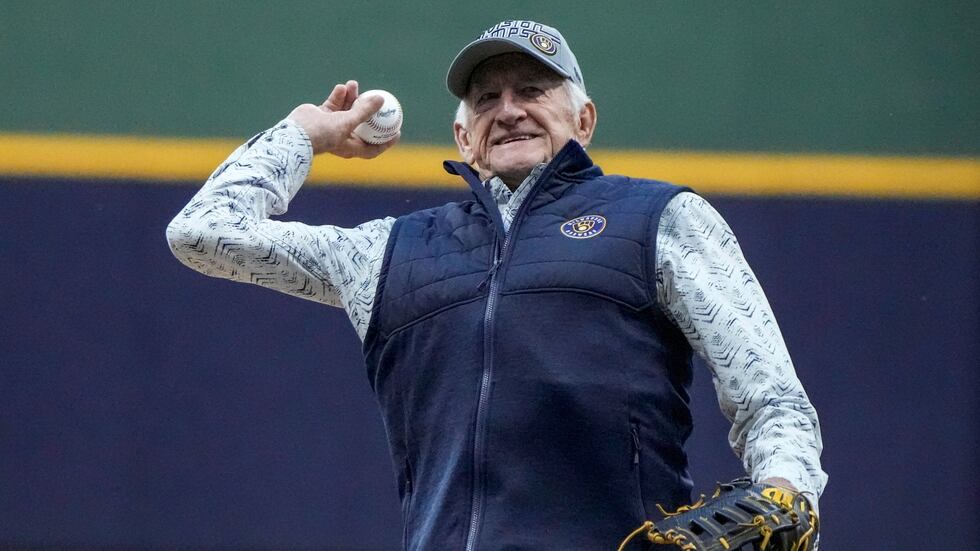 FILE - Bob Uecker throws the ceremonial first pitch before a Game 1 of the National League...