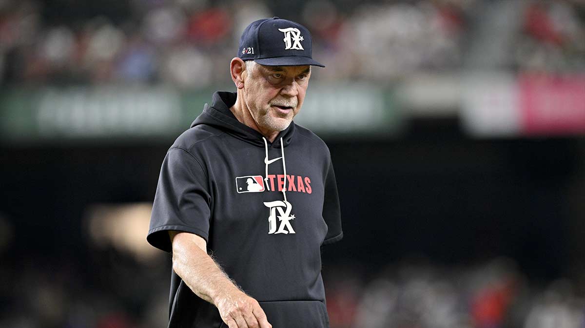 Jul 25, 2025; Arlington, Texas, USA; Texas Rangers manager Bruce Bochy (15) walks back to the dugout during the game against the Atlanta Braves at Globe Life Field. Mandatory Credit: Jerome Miron-Imagn Images