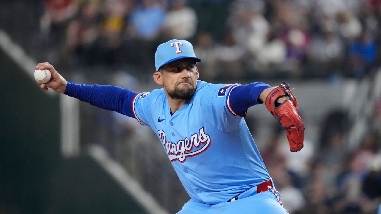 Texas Rangers starting pitcher Nathan Eovaldi throws during the first inning of a baseball game against the Boston Red Sox in Arlington, Texas, Sunday, Aug. 4, 2024. (AP Photo/LM Otero)