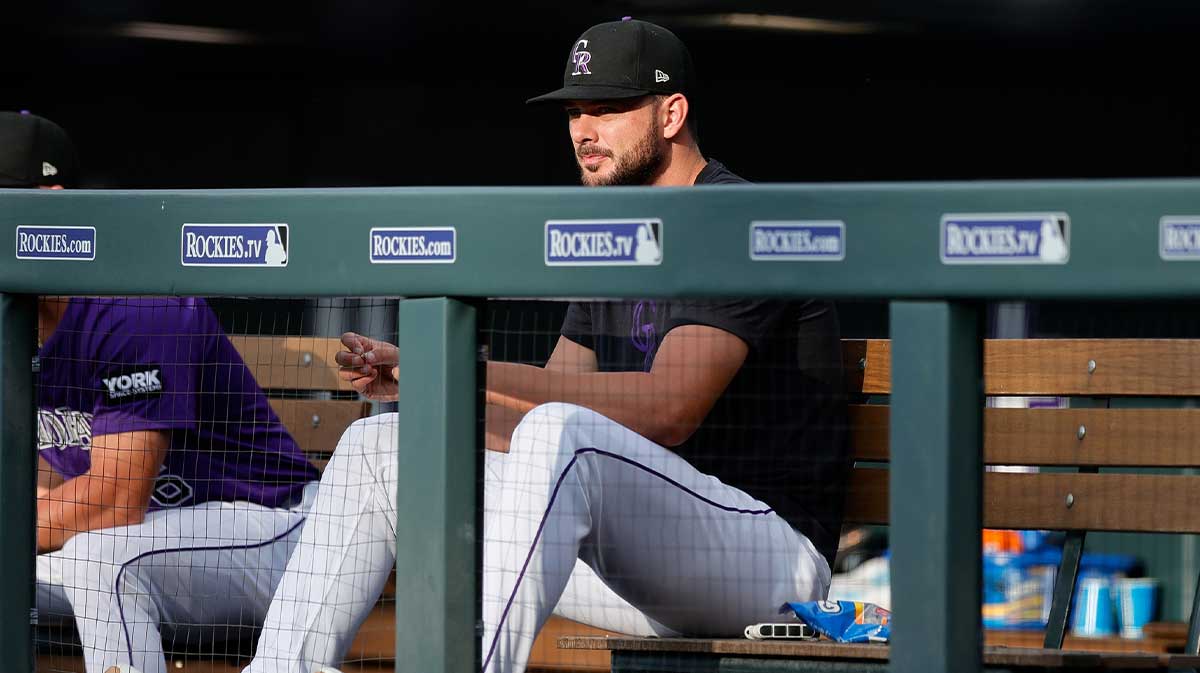 Colorado Rockies player Kris Bryant (23) looks on from the dugout in the first inning against the St. Louis Cardinals at Coors Field.