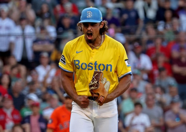 Boston Red Sox pitcher Jordan Hicks screams after the final out of the seventh with the bases loaded. (Staff Photo By Stuart Cahill/Boston Herald)