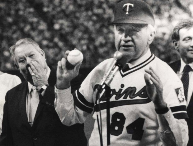 Former owner Calvin Griffith, left, holds back tears as new owner Carl Pohlad takes control of the Minnesota Twins in a ceremony at the Metrodome in Minneapolis on June 23, 1984. The Pohlad family, who have owned the team since 1984, announced Oct. 10, 2024 that it is exploring a sale of the franchise. (Pioneer Press file)