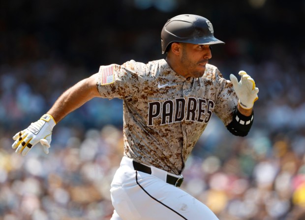The Padres' Ramón Laureano runs out a single in the fourth inning of Sunday's game against the Cardinals. (K.C. Alfred / The San Diego Union-Tribune)