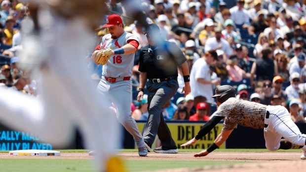 Freddy Fermin #54 of the San Diego Padres is forced out at third base by Nolan Gorman #16 of the St. Louis Cardinals in the third inning at Petco Park on Aug. 3, 2025 in San Diego, California. (K.C. Alfred / The San Diego Union-Tribune)