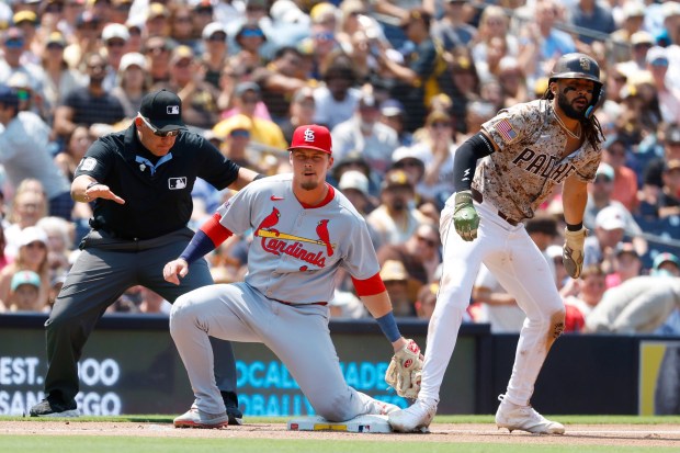 Fernando Tatis Jr. #23 of the San Diego Padres steals third base in the third inning as Nolan Gorman #16 of the St. Louis Cardinals tries to make a tag at Petco Park on Aug. 3, 2025 in San Diego, California. (K.C. Alfred / The San Diego Union-Tribune)