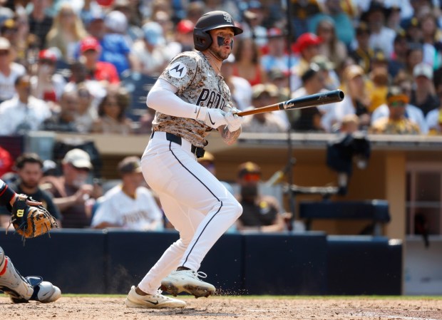 Jackson Merrill #3 of the San Diego Padres hits a three run triple in the eighth inning against St. Louis Cardinals at Petco Park on Aug. 3, 2025 in San Diego, California. (K.C. Alfred / The San Diego Union-Tribune)