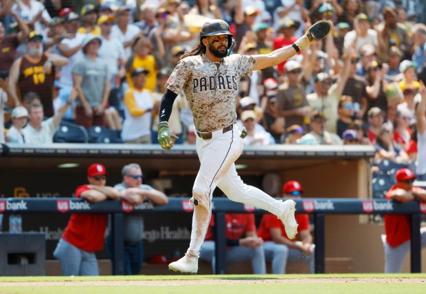 Fernando Tatis Jr. #23 of the San Diego Padres scores on a triple by Jackson Merrill #3 in the eighth inning against St. Louis Cardinals at Petco Park on Aug. 3, 2025 in San Diego, California. (K.C. Alfred / The San Diego Union-Tribune)