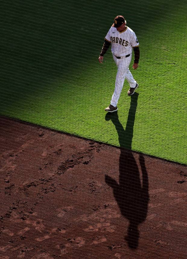 Mike Shildt #8 of the San Diego Padres walks back to the dugout during the fifth inning against the Philadelphia Phillies at Petco Park on Saturday, July 12, 2025 in San Diego, CA. (Meg McLaughlin / The San Diego Union-Tribune)