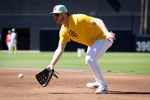 Ryan O'Hearn #32 of the San Diego Padres fields a ground ball before their game against the Cardinals at Petco Park on Friday, Aug. 1, 2025 in San Diego, CA. (Meg McLaughlin / The San Diego Union-Tribune)