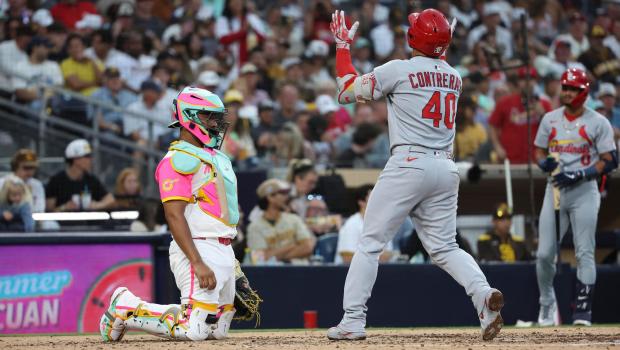 Elias Diaz #17 of the San Diego Padres looks on as Willson Contreras #40 of the St. Louis Cardinals celebrates after a home run during the fifth inning at Petco Park on Friday, Aug. 1, 2025 in San Diego, CA. (Meg McLaughlin / The San Diego Union-Tribune)
