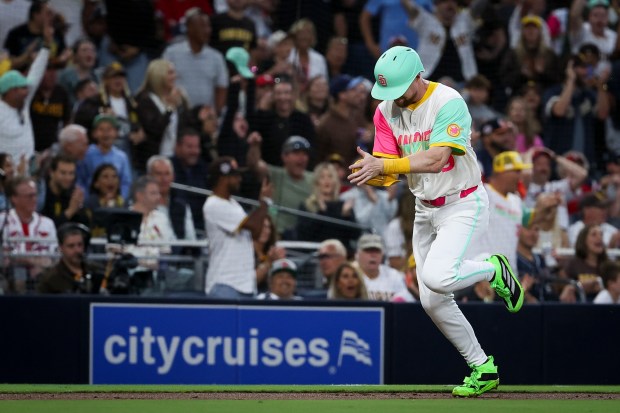 Jake Cronenworth #9 of the San Diego Padres celebrates as he scores a run against the St. Louis Cardinals during the fifth inning at Petco Park on Friday, Aug. 1, 2025 in San Diego, CA. (Meg McLaughlin / The San Diego Union-Tribune)