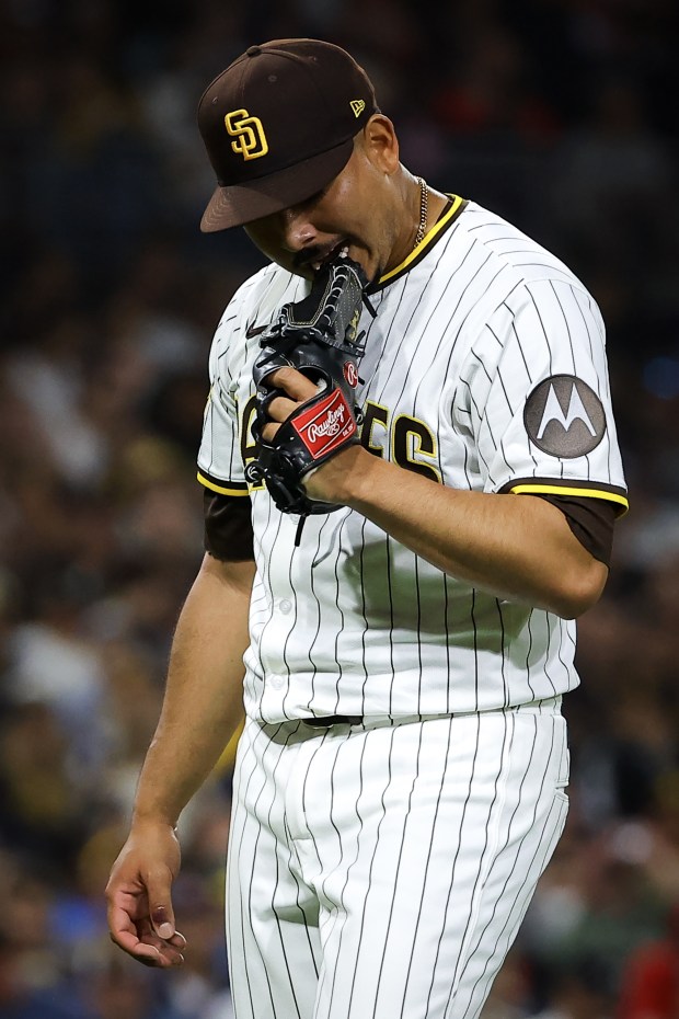 Jeremiah Estrada #56 of the San Diego Padres bites his glove as he walks back to the dugout during the fifth inning against the St. Louis Cardinals at Petco Park on Saturday, Aug. 2, 2025 in San Diego, CA. (Meg McLaughlin / The San Diego Union-Tribune)