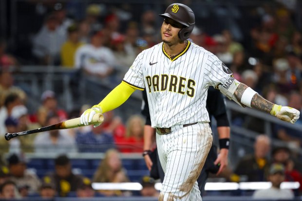 Manny Machado #13 of the San Diego Padres walks back to the dugout after striking out during the eighth inning against the St. Louis Cardinals at Petco Park on Saturday, Aug. 2, 2025 in San Diego, CA. (Meg McLaughlin / The San Diego Union-Tribune)
