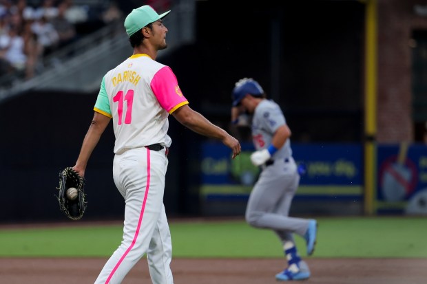 Yu Darvish #11 of the San Diego Padres looks on as Alex Freeland #76 of the Los Angeles Dodgers rounds the bases after a home run during the third inning at Petco Park on Friday, Aug. 22, 2025 in San Diego, CA. (Meg McLaughlin / The San Diego Union-Tribune)