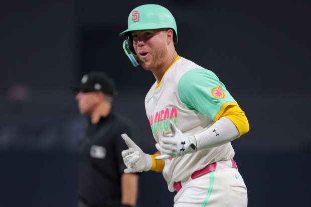 Gavin Sheets #30 of the San Diego Padres smiles after a single against the Los Angeles Dodgers during the fourth inning at Petco Park on Friday, Aug. 22, 2025 in San Diego, CA. (Meg McLaughlin / The San Diego Union-Tribune)