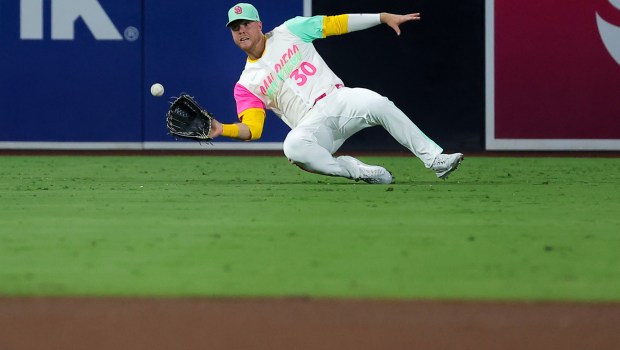 Gavin Sheets #30 of the San Diego Padres makes a catch in the outfield during the sixth inning against the Los Angeles Dodgers at Petco Park on Friday, Aug. 22, 2025 in San Diego, CA. (Meg McLaughlin / The San Diego Union-Tribune)