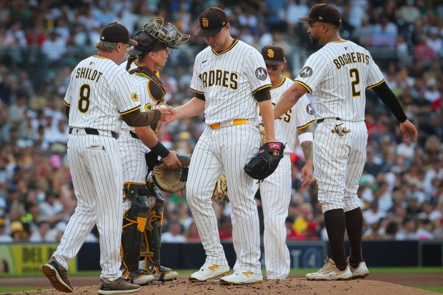 Manager Mike Shildt #8 of the San Diego Padres takes the ball from pitcher Michael King #34 during a pitching change in the third inning against the Boston Red Sox at Petco Park on Saturday, Aug. 9, 2025 in San Diego, CA. (Meg McLaughlin / The San Diego Union-Tribune)