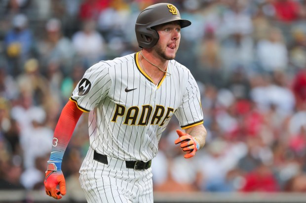 Jackson Merrill #3 of the San Diego Padres runs to first after lining out against the Boston Red Sox during the third inning at Petco Park on Saturday, Aug. 9, 2025 in San Diego, CA. (Meg McLaughlin / The San Diego Union-Tribune)