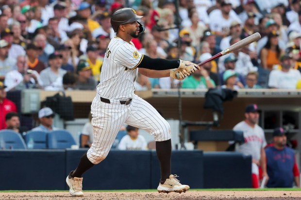 Xander Bogaerts #2 of the San Diego Padres doubles against the Boston Red Sox during the third inning at Petco Park on Saturday, Aug. 9, 2025 in San Diego, CA. (Meg McLaughlin / The San Diego Union-Tribune)