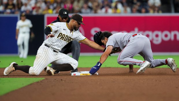 Xander Bogaerts #2 of the San Diego Padres tags out David Hamilton #17 of the Boston Red Sox during the eighth inning at Petco Park on Saturday, Aug. 9, 2025 in San Diego, CA. (Meg McLaughlin / The San Diego Union-Tribune)