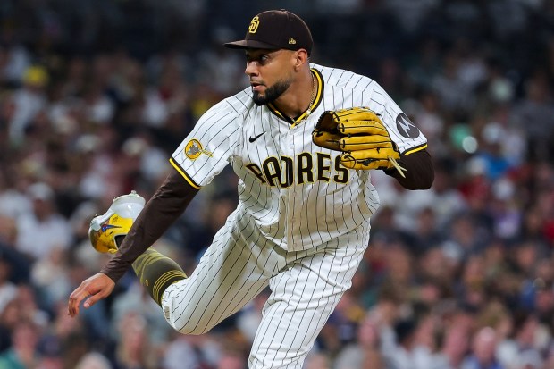 Robert Suarez #75 of the San Diego Padres pitches during the ninth inning against the Boston Red Sox at Petco Park on Saturday, Aug. 9, 2025 in San Diego, CA. (Meg McLaughlin / The San Diego Union-Tribune)