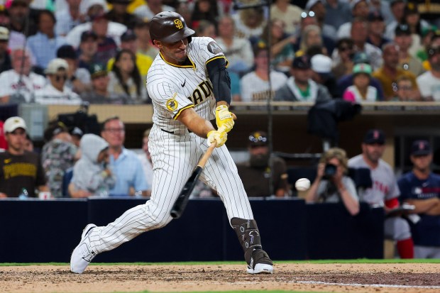 Ramon Laureano #5 of the San Diego Padres hits a walk-off single against the Boston Red Sox during the tenth inning at Petco Park on Saturday, Aug. 9, 2025 in San Diego, CA. (Meg McLaughlin / The San Diego Union-Tribune)