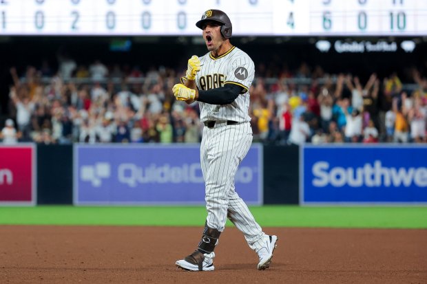 Ramon Laureano #5 of the San Diego Padres celebrates after his walk-off single against the Boston Red Sox during the tenth inning at Petco Park on Saturday, Aug. 9, 2025 in San Diego, CA. (Meg McLaughlin / The San Diego Union-Tribune)