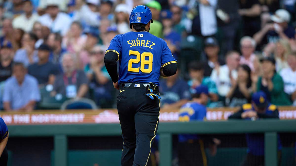 Seattle Mariners third baseman Eugenio Suarez (28) scores on a walk against the Texas Rangers during the second inning at T-Mobile Park.