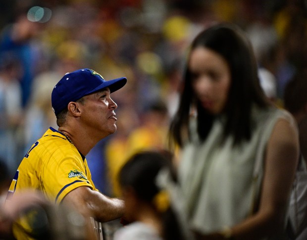 Honorary Savannah Bananas pitcher and former Colorado Rockies pitcher, Ubaldo Jiménez in the dugout after making pitching a few balls to The Firefighters at Coors Field in Denver, on Saturday, Aug. 09, 2025. (Photo by Andy Cross/The Denver Post)