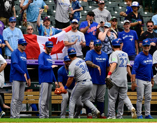 The Toronto Blue Jays celebrate their victory over the Colorado Rockies at Coors Field in Denver on Wednesday, Aug. 6, 2025. Colorado lost 20-1. (Photo by Andy Cross/The Denver Post)