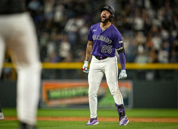 Warming Bernabel (25) of the Colorado Rockies roars after scoring Ezequiel Tovar (14) with a game-winning single against the Los Angeles Dodgers in the ninth inning of the Rockies' 4-3 win at Coors Field in Denver on Monday, Aug. 18, 2025. (Photo by AAron Ontiveroz/The Denver Post)