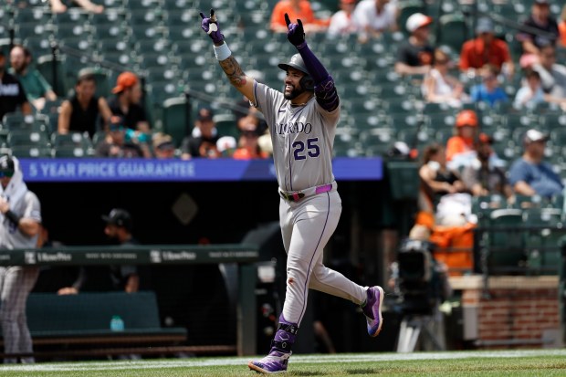 Colorado Rockies' Warming Bernabel gestures as he runs toward home plate after hitting a home run off Baltimore Orioles pitcher Tomoyuki Sugano during the second inning of a baseball game in Baltimore, Sunday, July 27, 2025. (AP Photo/Terrance Williams)