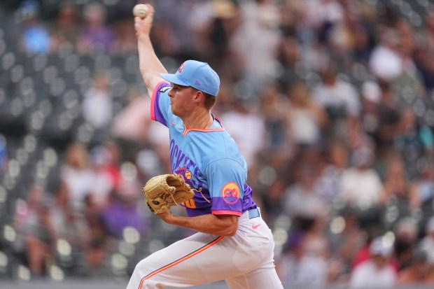 Colorado Rockies starting pitcher Tanner Gordon works against the Arizona Diamondbacks in the first inning of a baseball game Friday, Aug. 15, 2025, in Denver. (AP Photo/David Zalubowski)