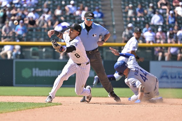 Los Angeles Dodgers' Andy Pages, right, steals second base from Colorado Rockies' Ryan Ritter in the 7th inning of the game at Coors Field in Denver on Thursday, Aug. 21, 2025. Los Angeles won 9-5. (Photo by Hyoung Chang/The Denver Post)