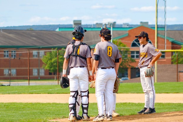 Northwestern Lehigh players huddle with their pitcher as seen here, playing against the Panthers in the first round of the Pennsylvania Interscholastic Athletic Association, Inc. Championships. (Oliver Lois Economidis/The Morning Call)