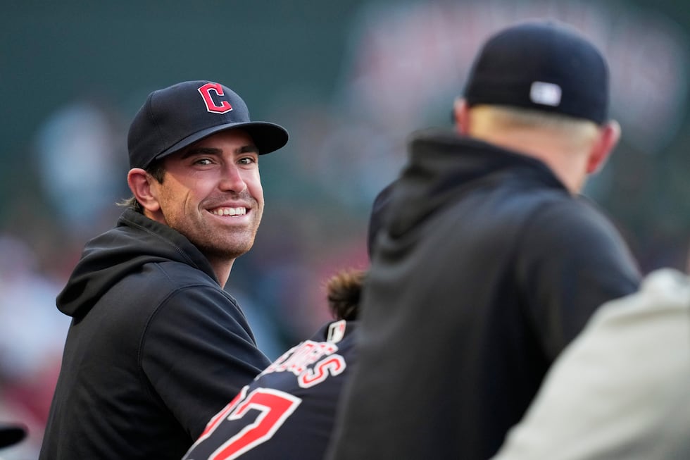 FILE - Cleveland Guardians' Shane Bieber stands in the dugout during the third inning of a...